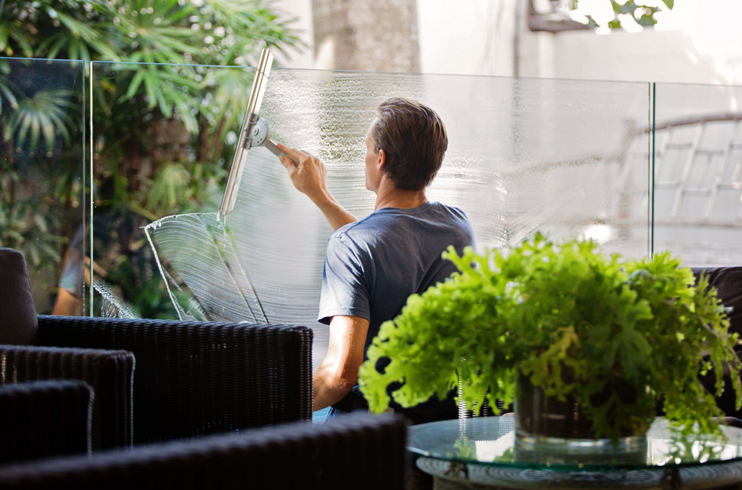 man cleaning window